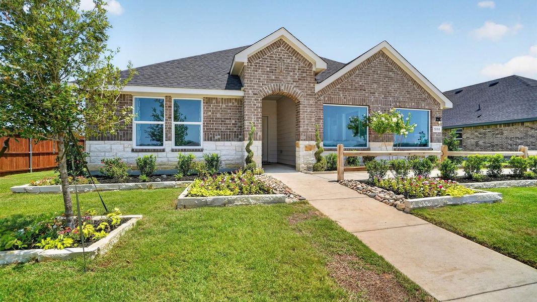 Front exterior of a home in the Saratoga community, located in Granbury, TX (Image 16).