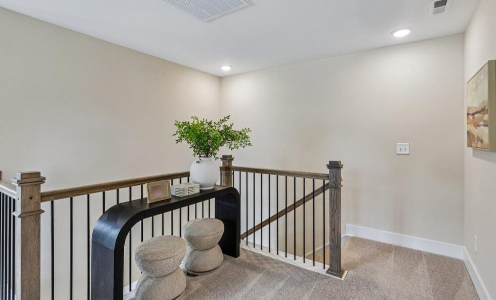 Furnished interior in a model home at Bellevue Townhomes in Greenville (Image 18).