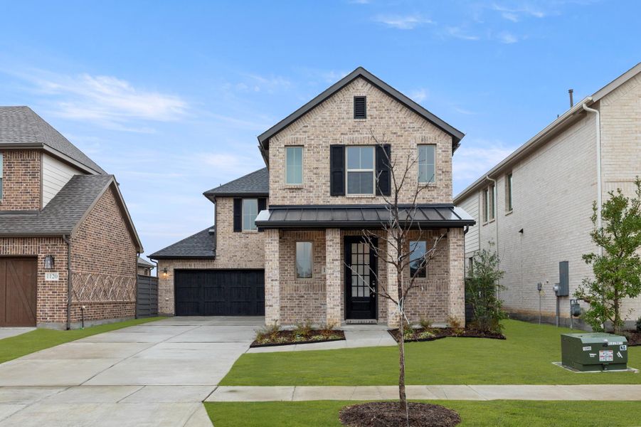 Front exterior of a home in the Union Park 40s community, located in Little Elm, TX (Image 14).