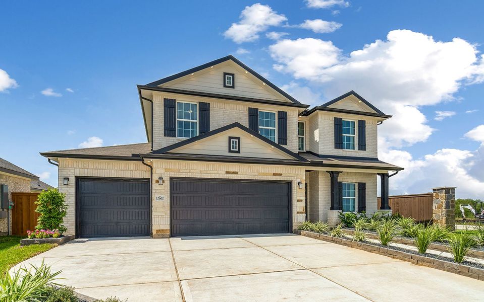 Front exterior of a home in the Harvest Pointe community, located in Needville, TX (Image 8).