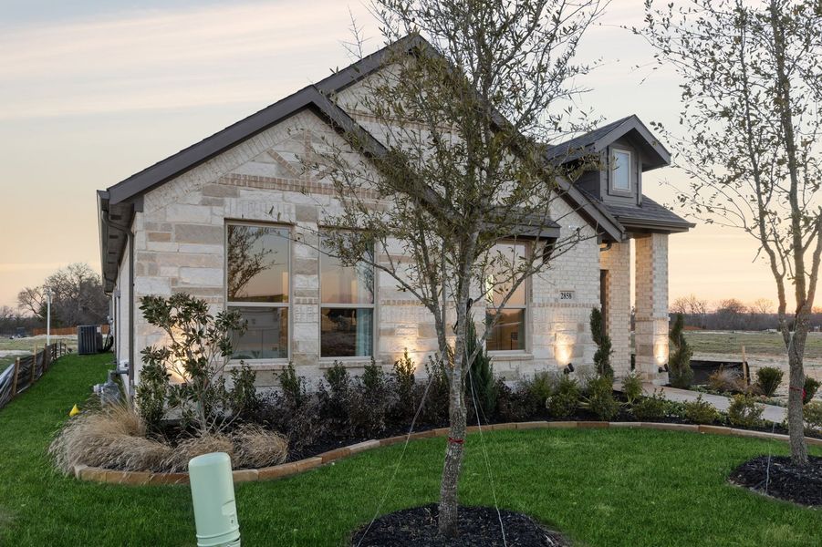 Front exterior of a home in the Redden Farms – Active Adult community, located in Midlothian, TX (Image 36).