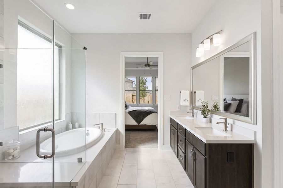 Furnished interior in a model home at Sunterra in Katy (Image 30).