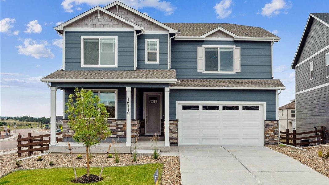 Front exterior of a home in the Willow Springs Ranch community, located in Monument, CO (Image 1).