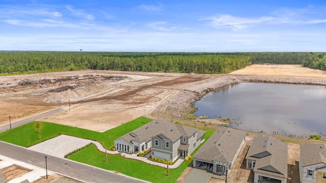 A flooded area with houses and a dam.