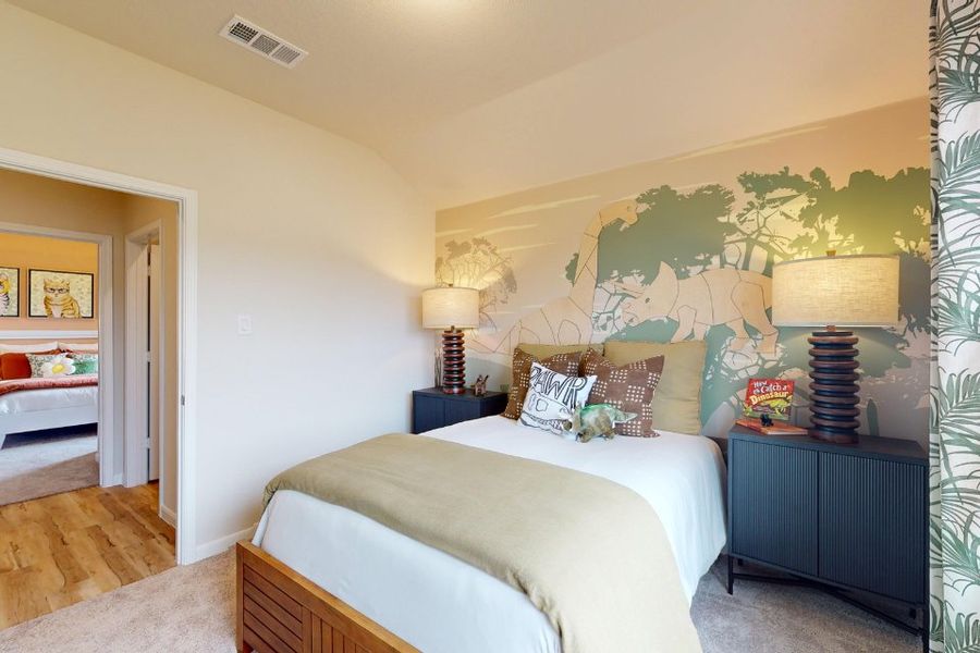 A bedroom with a bed and lamps. A bedroom with a bed and lamps.