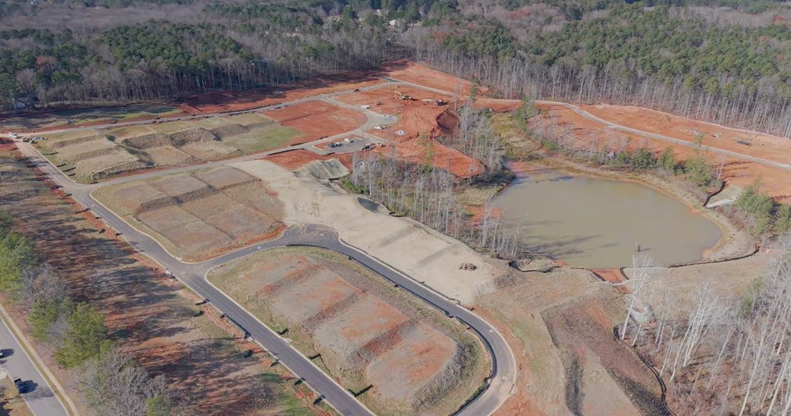 A large dam with a river running through it. A large dam with a river running through it.