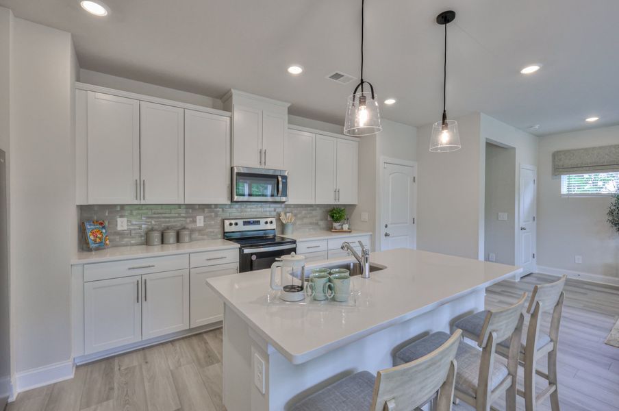 Designer-curated finishes, including marble countertops, create an elegant feel. Designer-curated finishes, including marble countertops, create an elegant feel.