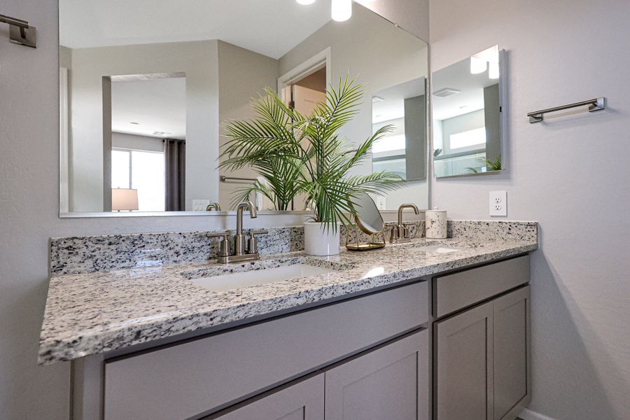 A bathroom with a marble countertop. A bathroom with a marble countertop.