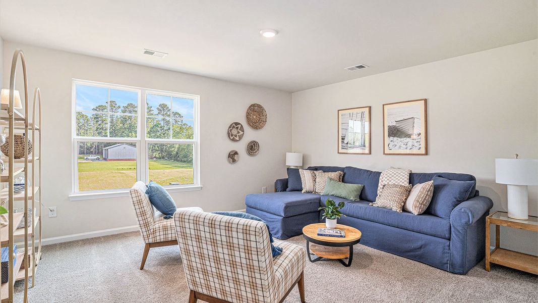 Furnished interior in a model home at Preserve at Cypress Commons in Conway (Image 11).