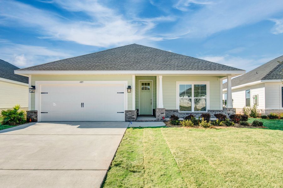 Front exterior of a home in the The Bluffs at Lafayette community, located in Freeport, FL (Image 2).