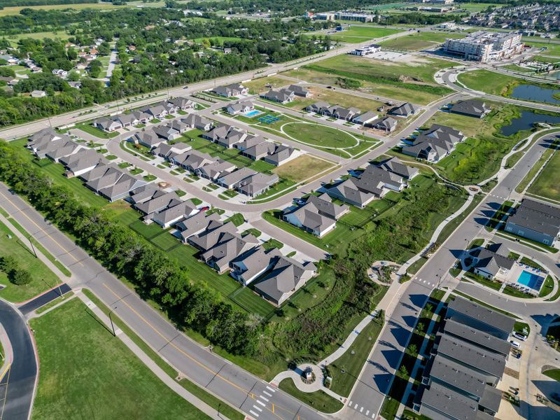 Aerial view of the The Courtyards at The Heritage community in Andover, KS, showing layout and nearby surroundings (Image 8). Aerial view of the The Courtyards at The Heritage community in Andover, KS, showing layout and nearby surroundings (Image 8).