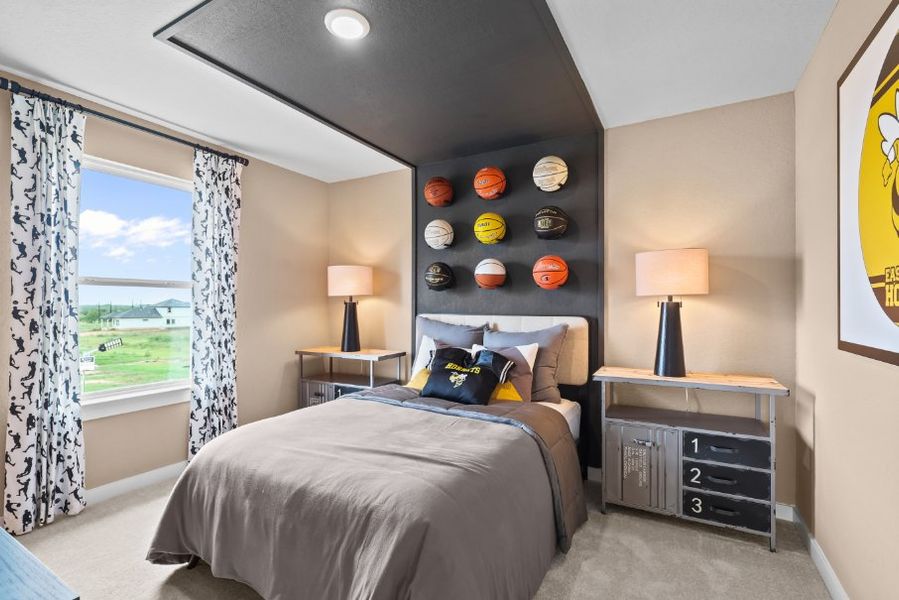 A bedroom with a large window. A bedroom with a large window.