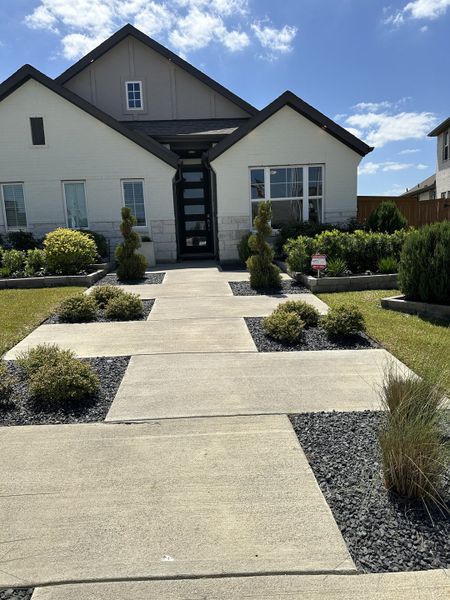 A charming modern home with neat landscaping in Cypress Green by Brightland Homes (Hockley, TX). A charming modern home with neat landscaping in Cypress Green by Brightland Homes (Hockley, TX).