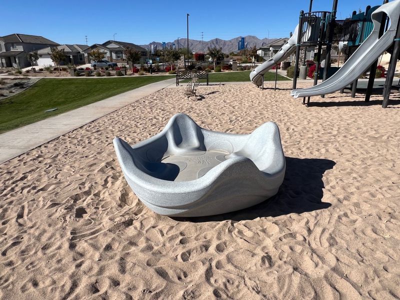 A vibrant playground with slides and a unique play structure in Northern Farms by Landsea Homes, Waddell, AZ. A vibrant playground with slides and a unique play structure in Northern Farms by Landsea Homes, Waddell, AZ.