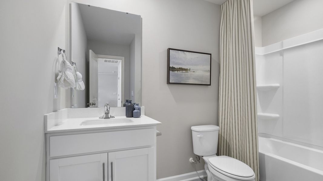 Furnished interior in a model home at The Preserve at Kinsley in Jamestown (Image 21).