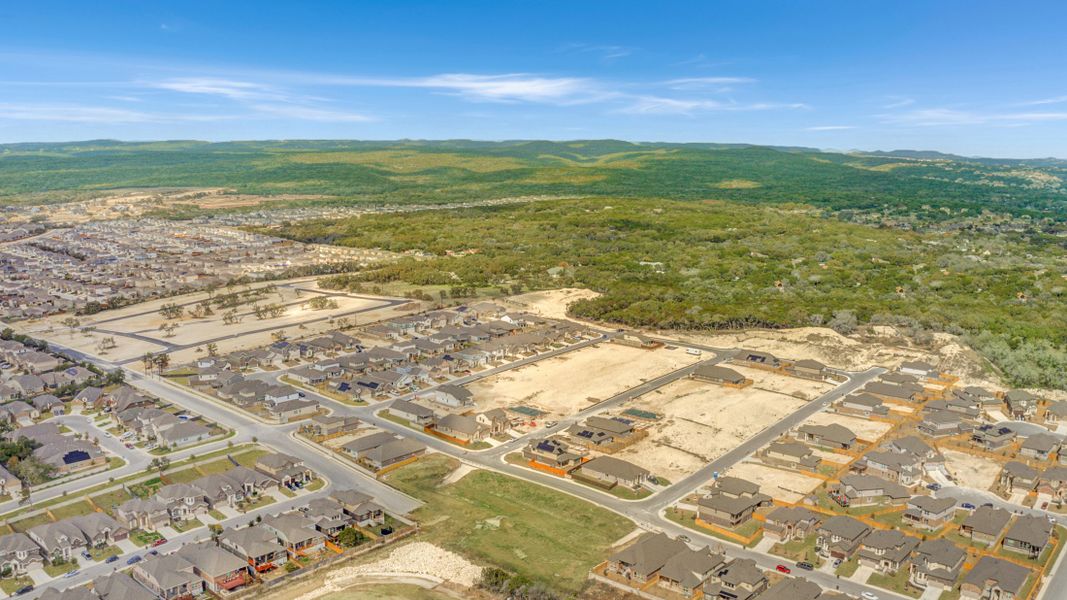 Aerial view of the Bricewood community in Helotes, TX, showing layout and nearby surroundings (Image 1).