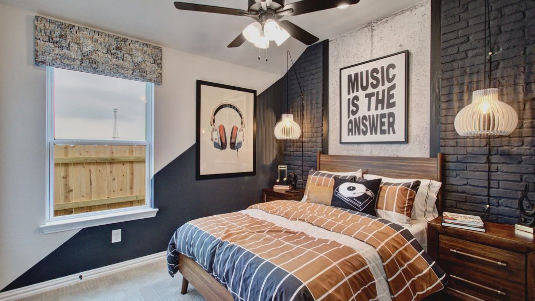 Elegant black brick accents enrich this chic bedroom design in Sunflower Ridge, exuding modern luxury.