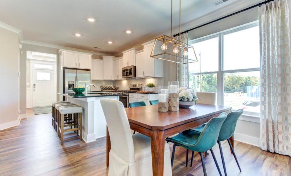 Furnished interior in a model home at CraigStone in Woodruff (Image 10).