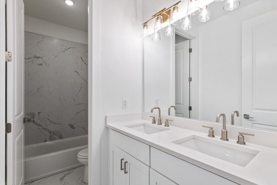 Furnished interior in a model home at Brizo in Santa Rosa Beach (Image 33).