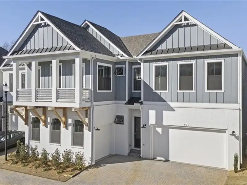 Front exterior of a home in the The Village at Towne Lake community, located in Woodstock, GA (Image 5).