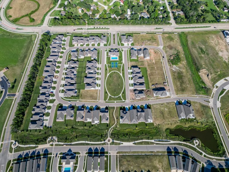 Aerial view of the The Courtyards at The Heritage community in Andover, KS, showing layout and nearby surroundings (Image 10). Aerial view of the The Courtyards at The Heritage community in Andover, KS, showing layout and nearby surroundings (Image 10).