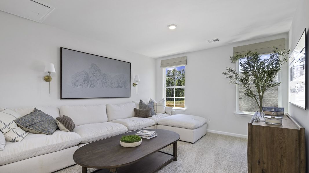 Furnished interior in a model home at The Preserve at Kinsley in Jamestown (Image 19).