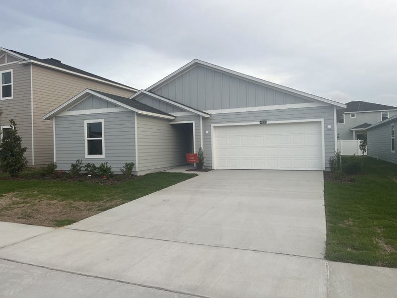 A charming gray home with clean lines and a neat lawn in Marion Ranch: Marion Ranch 40's by Lennar (Ocala, FL). 