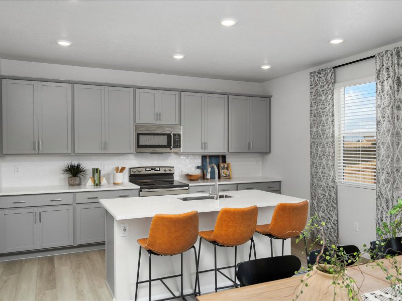Furnished interior in a model home at Frontier Estates - The Trails Collection in Firestone (Image 4).