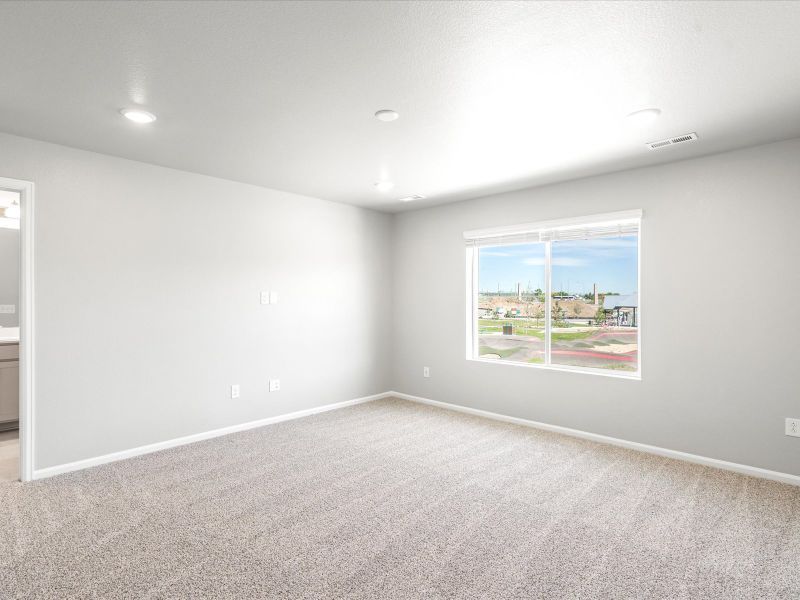 Bedroom in the Woodland floorplan at a Meritage Homes community in Broomfield, CO.