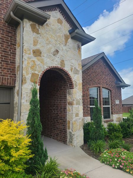A charming brick and stone home with vibrant landscaping in Elevon by D.R. Horton (Lavon, TX). A charming brick and stone home with vibrant landscaping in Elevon by D.R. Horton (Lavon, TX).