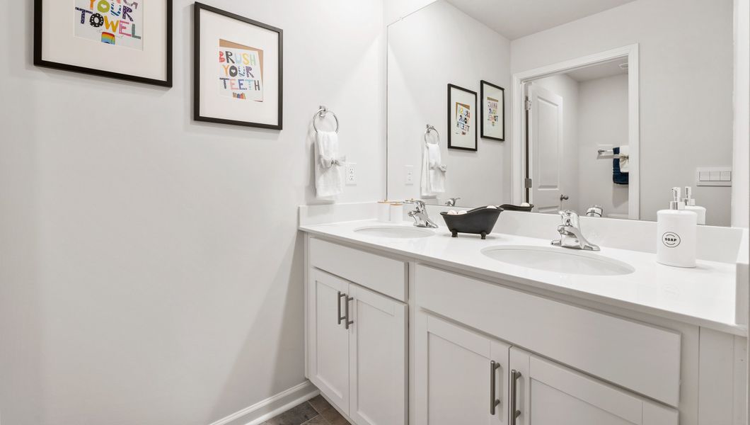 Furnished interior in a model home at Paddock Point in Roebuck (Image 14).