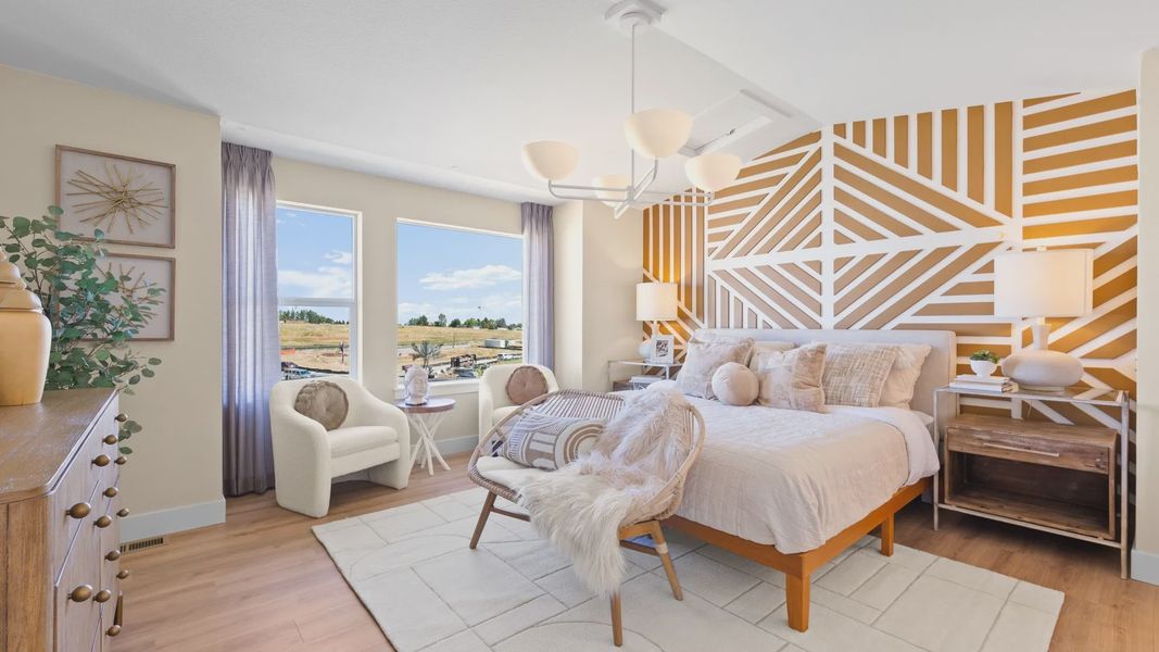 Dillon Pointe bedroom boasts a striking geometric accent wall and expansive windows for serene countryside views. Dillon Pointe bedroom boasts a striking geometric accent wall and expansive windows for serene countryside views.