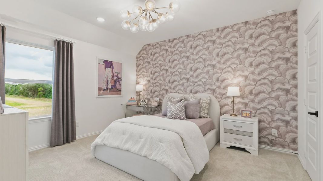 Experience sophistication with a cloud-themed accent wall, plush carpeting, and a designer light fixture in Katy Lakes. Experience sophistication with a cloud-themed accent wall, plush carpeting, and a designer light fixture in Katy Lakes.