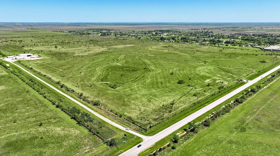 A road going through a field. A road going through a field.