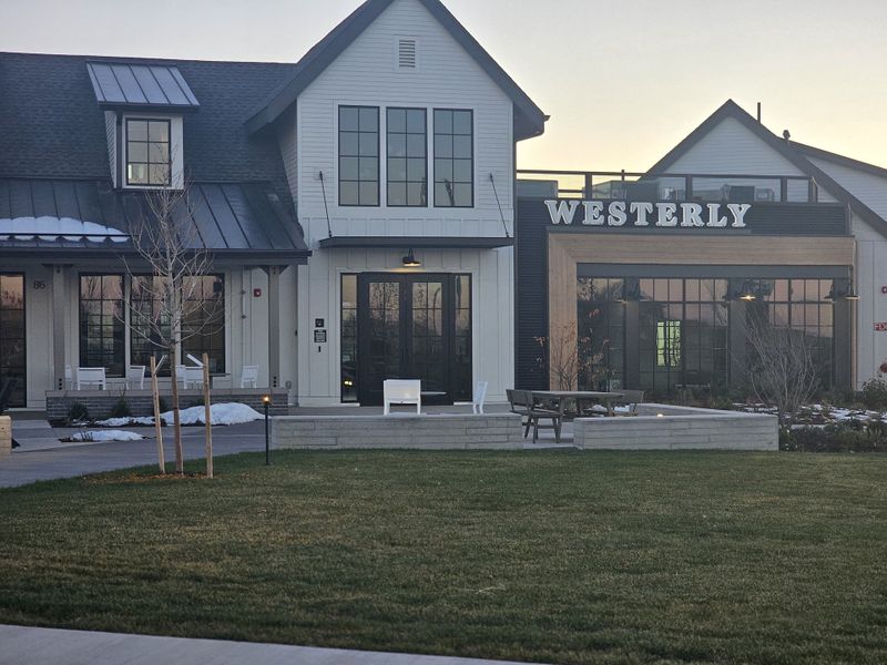 A modern clubhouse with large windows and sleek design in the community of Westerly by SLC Homes (Erie, CO).