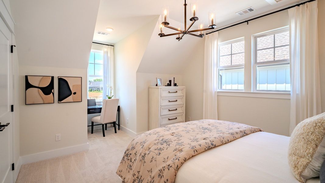 Bedroom with carpet and windows