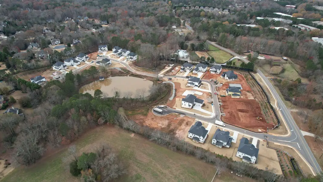 Aerial view of the The Retreat at Caney Creek community in Alpharetta, GA, showing layout and nearby surroundings (Image 1). Aerial view of the The Retreat at Caney Creek community in Alpharetta, GA, showing layout and nearby surroundings (Image 1).