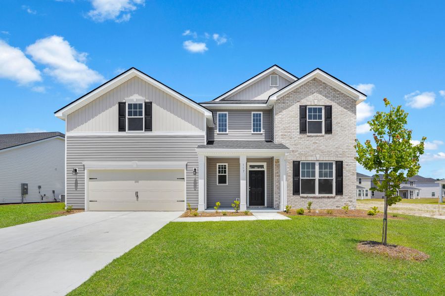 Front exterior of a home in the Camden Crossing community, located in Savannah, GA (Image 8). Front exterior of a home in the Camden Crossing community, located in Savannah, GA (Image 8).