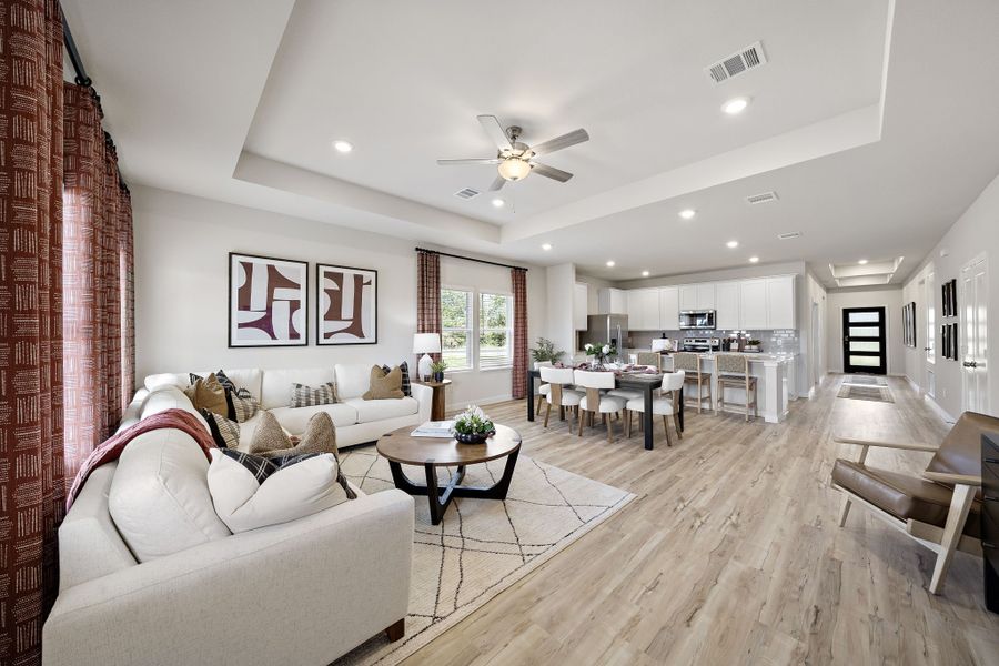A living room with a wood floor. A living room with a wood floor.