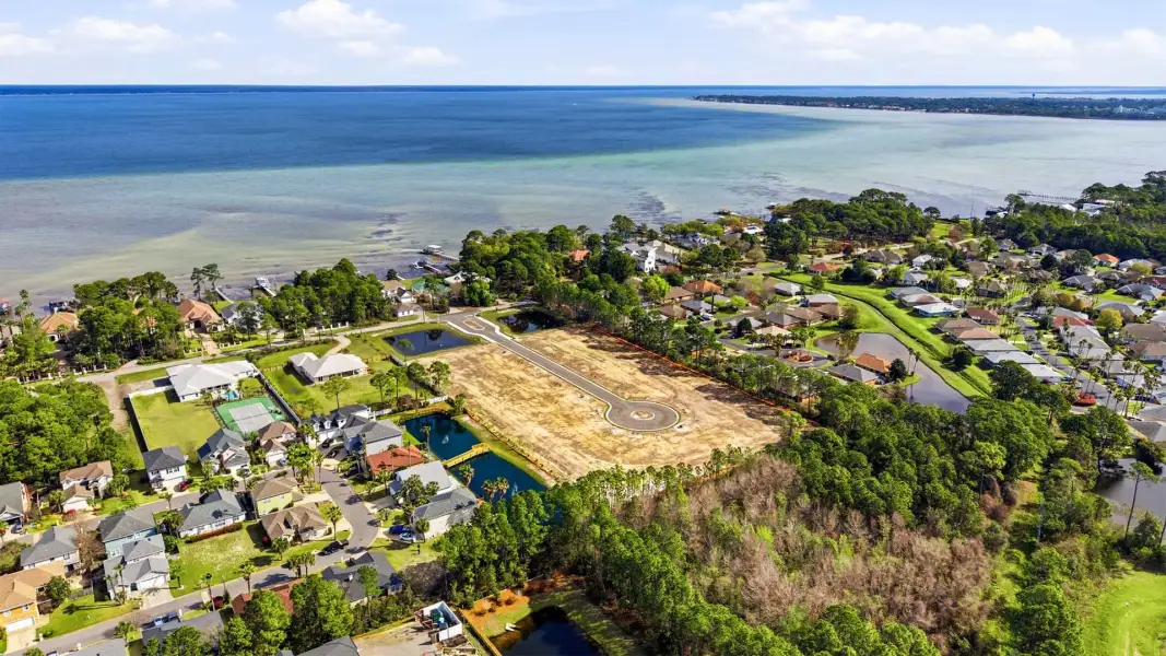 Aerial view of the Crest Bay Cottages community in Miramar Beach, FL, showing layout and nearby surroundings (Image 12). Aerial view of the Crest Bay Cottages community in Miramar Beach, FL, showing layout and nearby surroundings (Image 12).