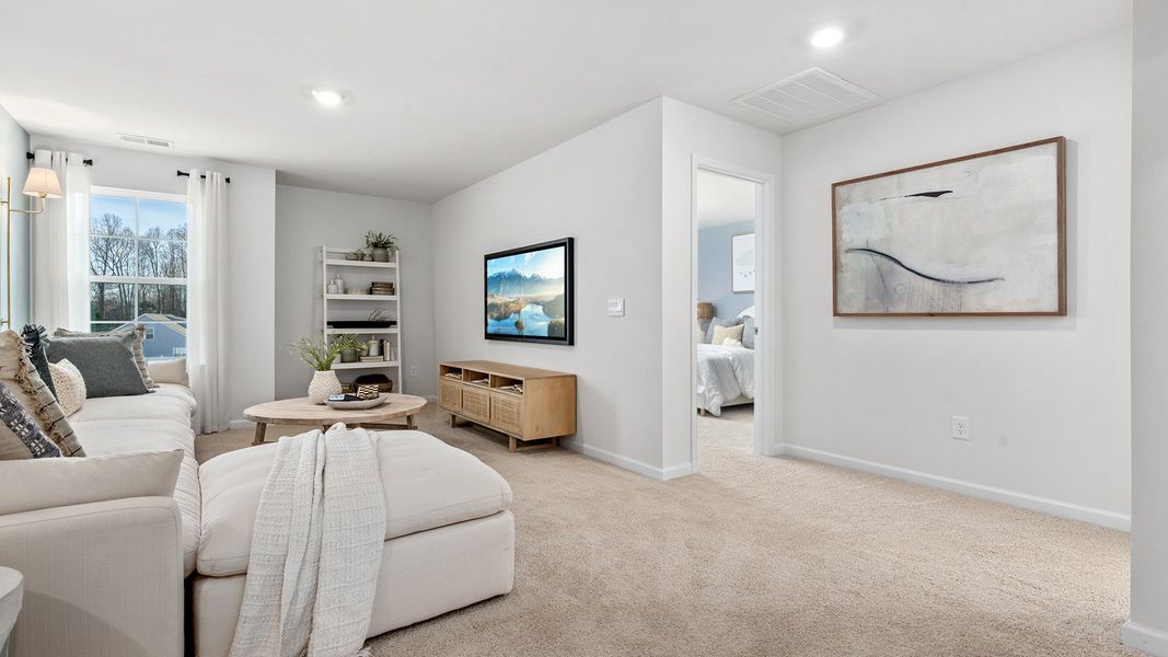 Furnished interior in a model home at The Reserve at Stoney Creek in Whitsett (Image 27).