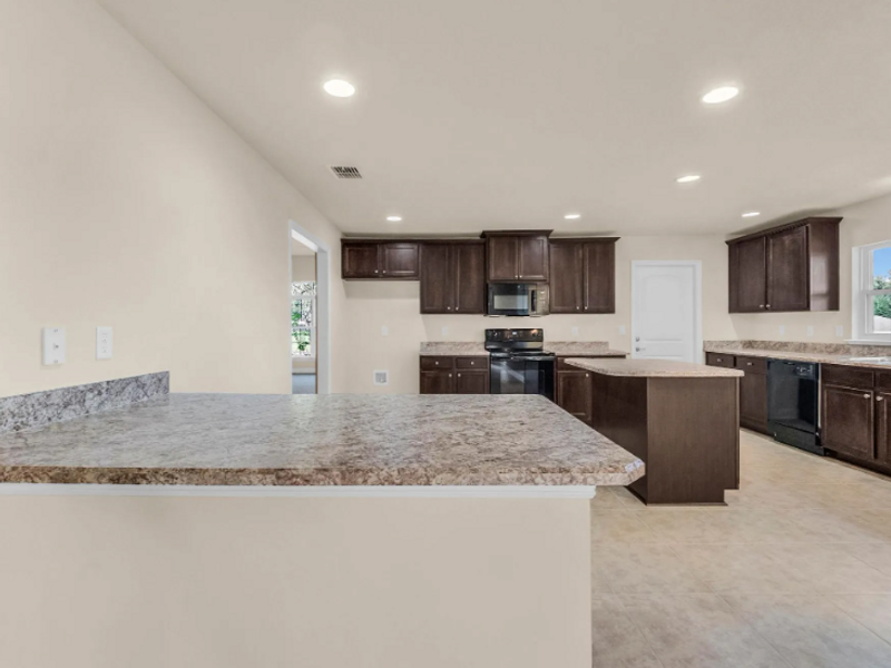 Furnished interior in a model home at Pine Ridge in Beverly Hills (Image 12).