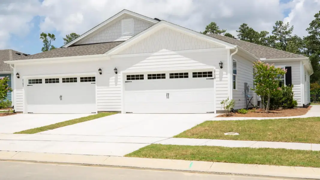 Front exterior of a home in the The Retreat at Indigo Preserve Townhomes community, located in Leland, NC (Image 4).