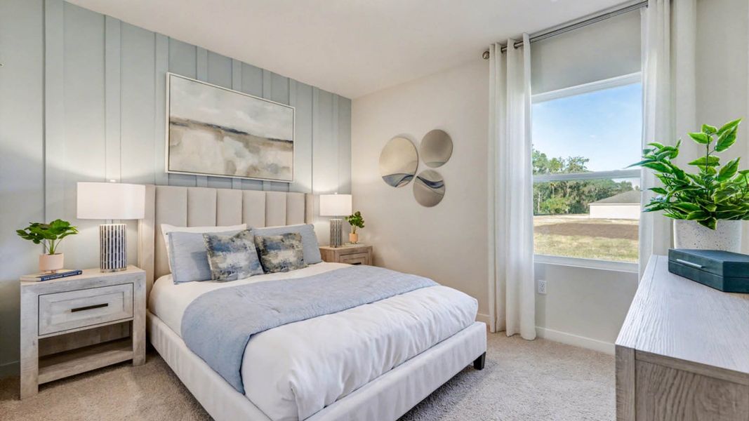 Furnished interior in a model home at Indian River Preserve in Mims (Image 20).