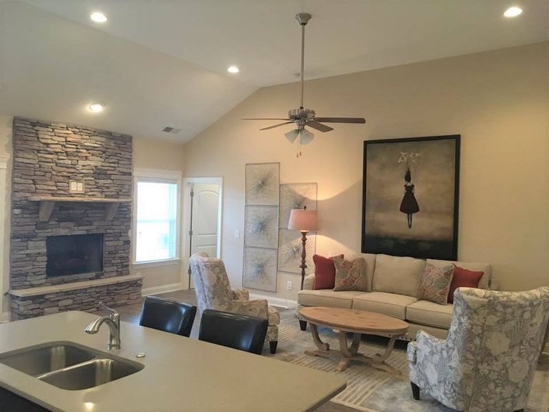 Vaulted ceilings and stunning interior stone fireplaces