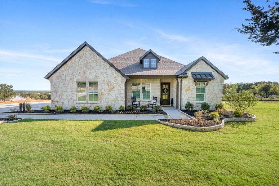 Front exterior of a home in the Oak Grove Addition community, located in Springtown, TX (Image 2).