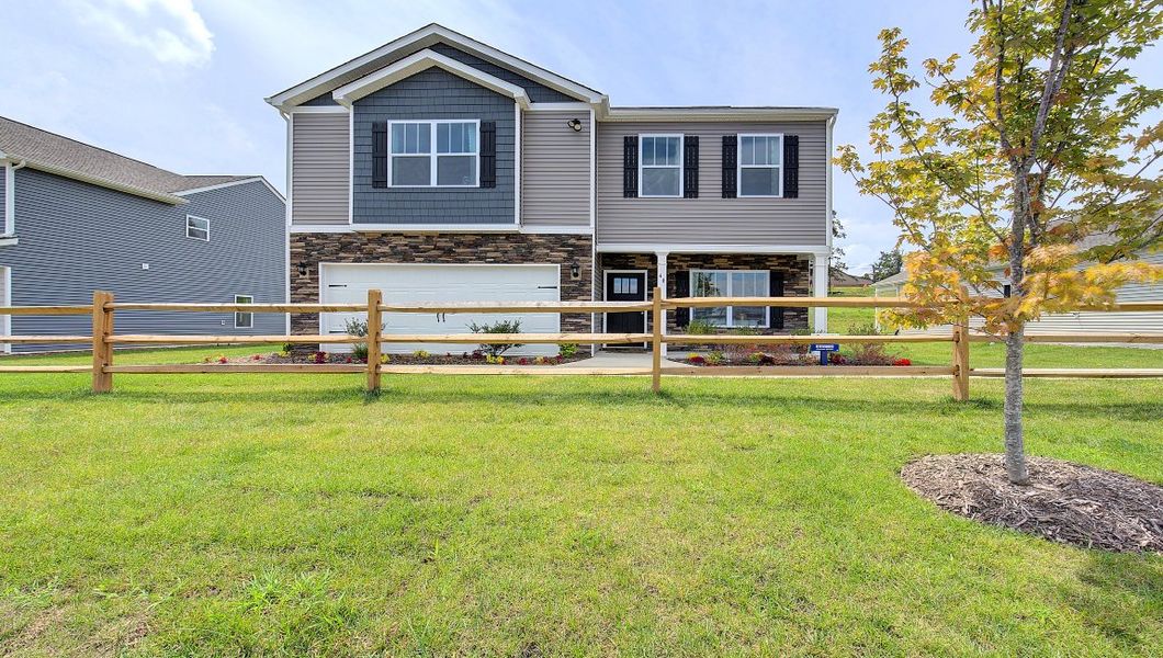 Front exterior of a home in the Tap Root Farms community, located in Fletcher, NC (Image 1).