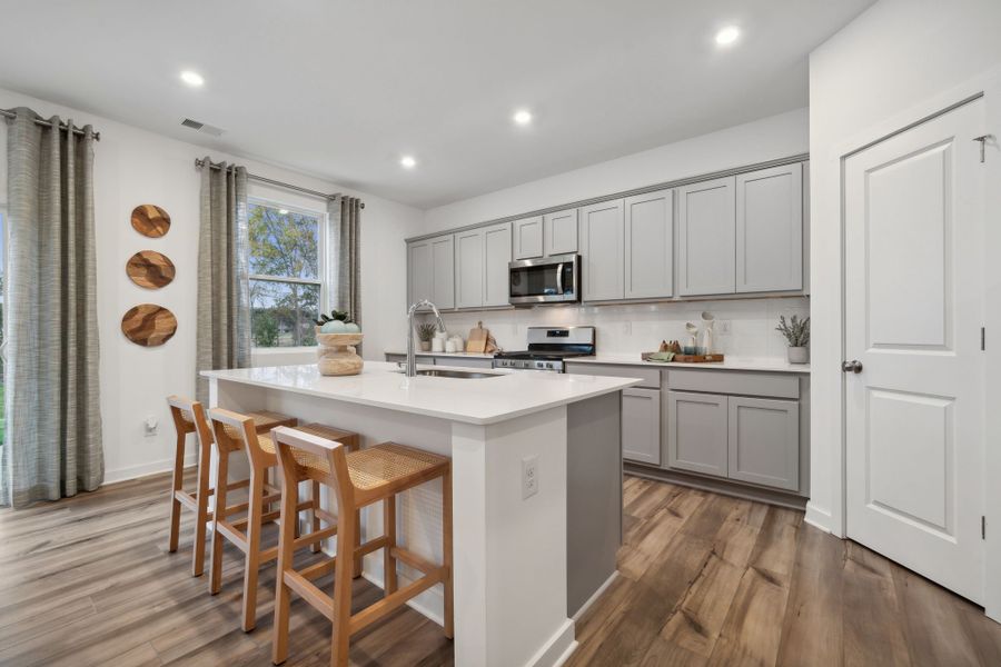 A kitchen with white cabinets. A kitchen with white cabinets.