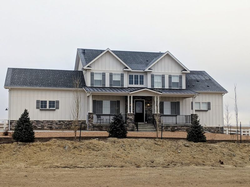 Front exterior of a home in the Red Barn community, located in Platteville, CO (Image 3).