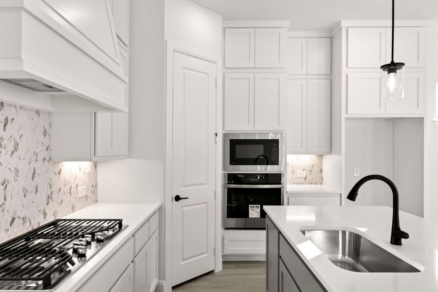 Furnished interior in a model home at West Crossing in Anna (Image 7).